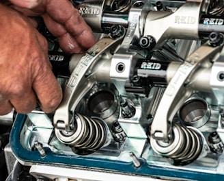 a close up of a person working on a machine